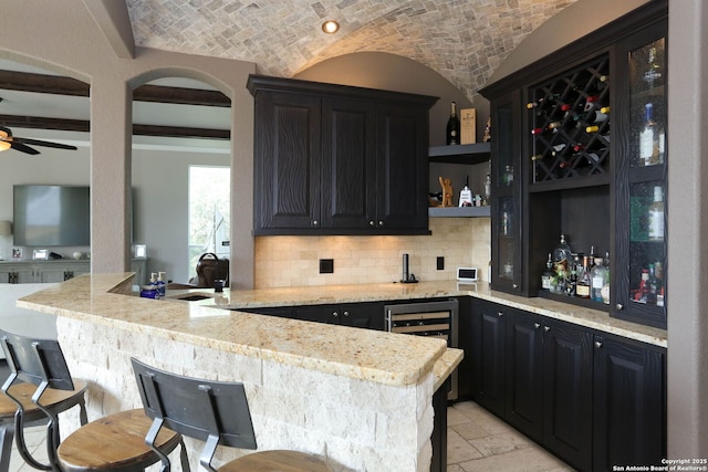 1818 Palmer Vw, San Antonio, TX 78260 - indoor bar with brick ceiling, beverage cooler, backsplash, ceiling fan, and lofted ceiling