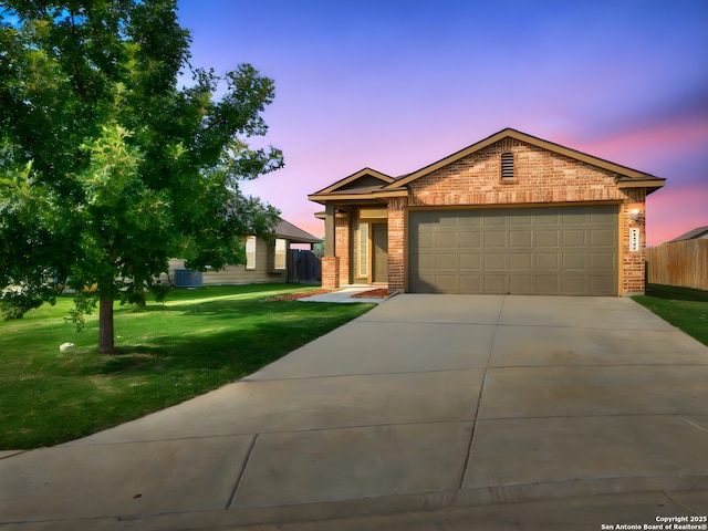 2325 Lighthouse, New Braunfels, TX 78130 - view of front of house with brick siding, driveway, and a garage