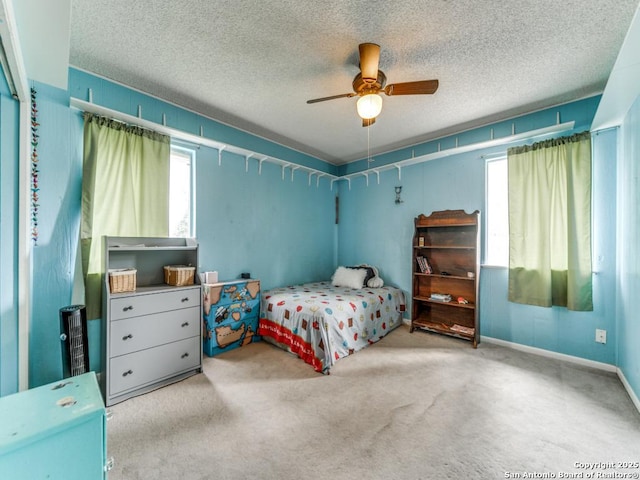 6802 S Forest Hvn, San Antonio, TX 78240 - bedroom featuring multiple windows, carpet flooring, and a textured ceiling