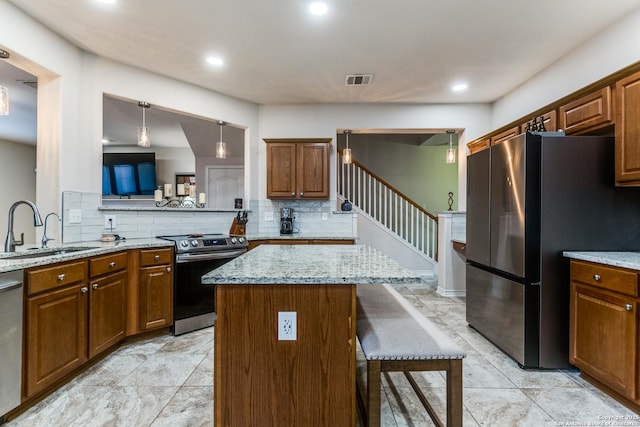 1342 Pinnacle, San Antonio, TX 78260 - kitchen featuring a sink, appliances with stainless steel finishes, backsplash, a breakfast bar, and light stone counters
