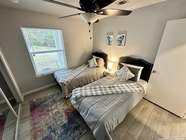 6422 Balky St, San Antonio, TX 78240 - bedroom featuring wood finished floors, ceiling fan, and baseboards