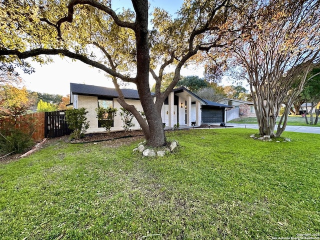 6422 Balky St, San Antonio, TX 78240 - mid-century inspired home with a garage, brick siding, and concrete driveway