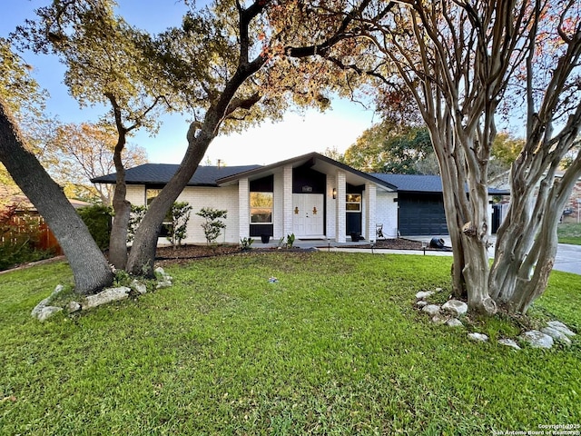 6422 Balky St, San Antonio, TX 78240 - mid-century home with a garage, brick siding, and a front yard