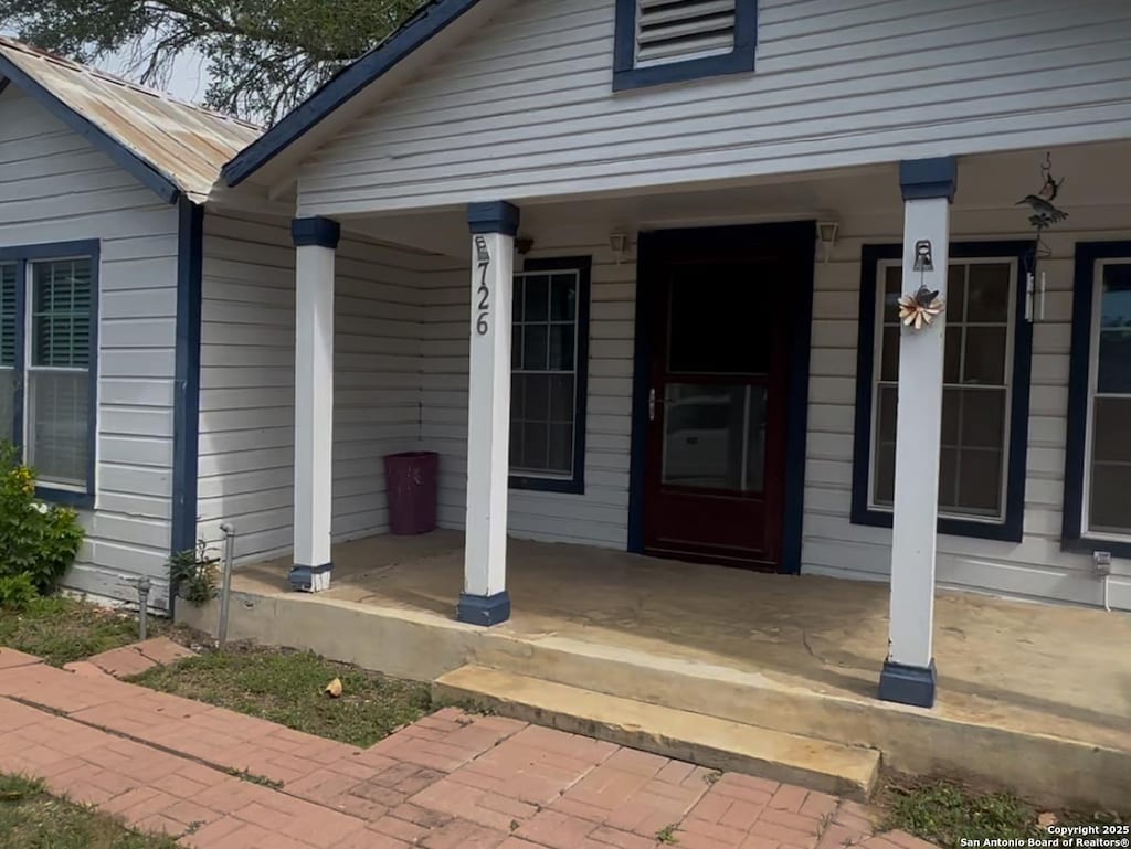726 Ave L, Poteet, TX 78065 - entrance to property with a porch
