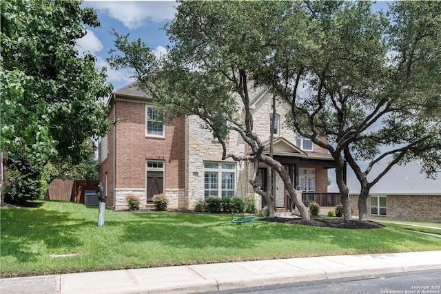 21910 Barton Woods, San Antonio, TX 78259 - view of front facade with stone siding, brick siding, and cooling unit