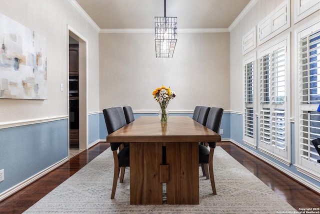 21910 Barton Woods, San Antonio, TX 78259 - dining room with dark wood finished floors, crown molding, a chandelier, and baseboards