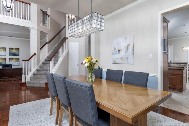 21910 Barton Woods, San Antonio, TX 78259 - dining space with wood finished floors, stairway, a chandelier, ornamental molding, and ornate columns