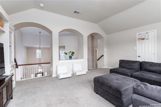 21910 Barton Woods, San Antonio, TX 78259 - living area with lofted ceiling, carpet flooring, baseboards, and arched walkways