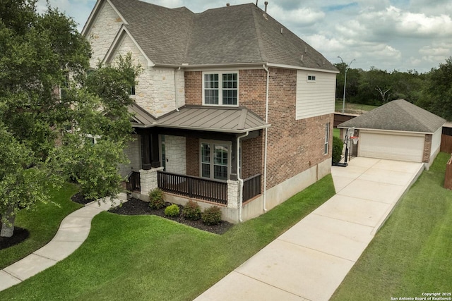 21910 Barton Woods, San Antonio, TX 78259 - view of front of house with a porch, a standing seam roof, a front lawn, brick siding, and an outdoor structure