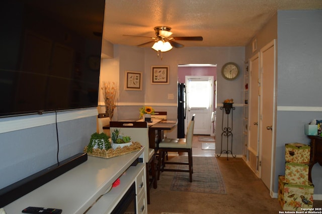 6611 S Point St Unit 111-C, San Antonio, TX 78229 - kitchen featuring freestanding refrigerator, ceiling fan, carpet, and a textured ceiling