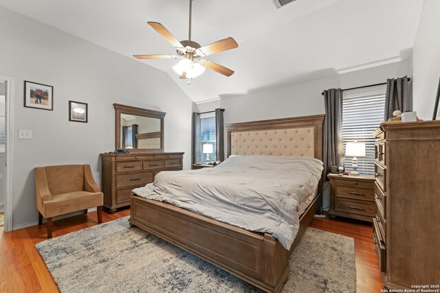 122 Rimdale, Universal City, TX 78148 - bedroom featuring light wood finished floors, vaulted ceiling, and a ceiling fan