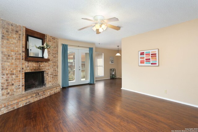 9357 Dover, San Antonio, TX 78250 - unfurnished living room featuring ceiling fan, wood finished floors, baseboards, french doors, and a textured ceiling