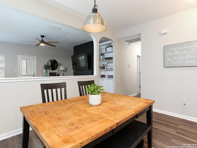 10831 Colt Chase, San Antonio, TX 78254 - dining room featuring ceiling fan, dark wood-type flooring, baseboards, and built in features
