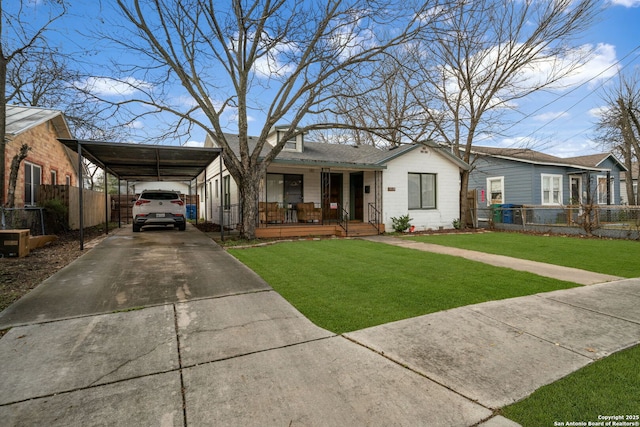1119 N Pine St, San Antonio, TX 78202 - view of front facade featuring a porch, driveway, and a carport