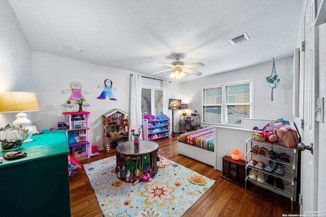 1119 N Pine St, San Antonio, TX 78202 - bedroom with wood finished floors and ceiling fan
