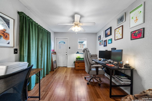 1119 N Pine St, San Antonio, TX 78202 - office featuring ceiling fan, wood finished floors, baseboards, and a textured wall