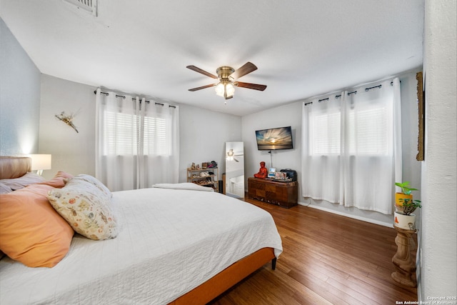 1119 N Pine St, San Antonio, TX 78202 - bedroom with wood finished floors and a ceiling fan