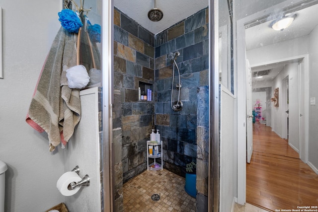 1119 N Pine St, San Antonio, TX 78202 - full bath with tiled shower and wood finished floors