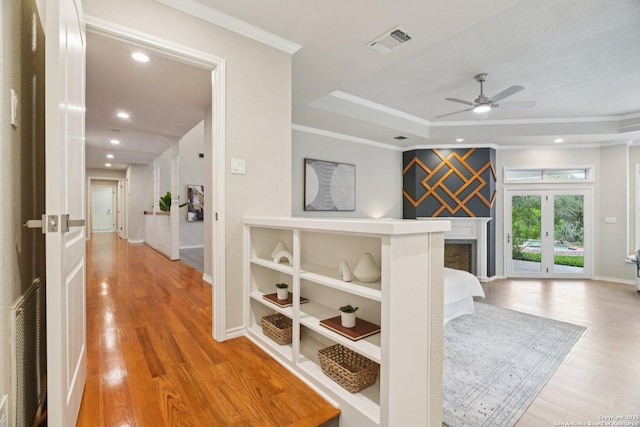 21641 Forest Waters, Garden Ridge, TX 78266 - hall featuring a raised ceiling, wood finished floors, baseboards, recessed lighting, and crown molding