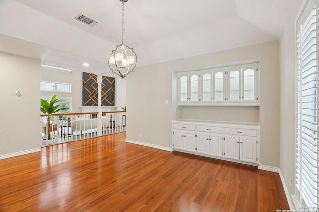 21641 Forest Waters, Garden Ridge, TX 78266 - empty room with wood finished floors, a chandelier, baseboards, recessed lighting, and lofted ceiling