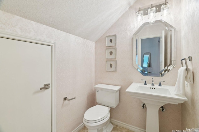 21641 Forest Waters, Garden Ridge, TX 78266 - bathroom featuring a textured ceiling, toilet, and lofted ceiling