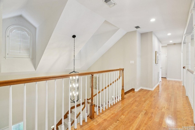 21641 Forest Waters, Garden Ridge, TX 78266 - hallway with wood finished floors, recessed lighting, vaulted ceiling, an upstairs landing, and a chandelier