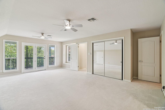 21641 Forest Waters, Garden Ridge, TX 78266 - unfurnished bedroom with light carpet, access to exterior, baseboards, a ceiling fan, and a closet