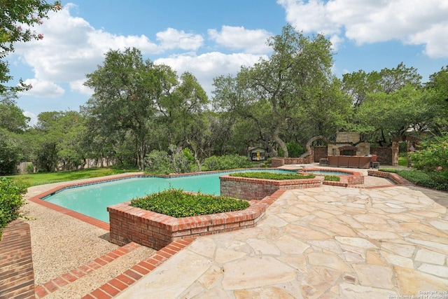21641 Forest Waters, Garden Ridge, TX 78266 - outdoor pool with a patio area, an in-ground hot tub, and view of scattered trees