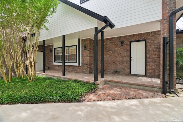 21641 Forest Waters, Garden Ridge, TX 78266 - view of exterior entry with a porch and brick siding