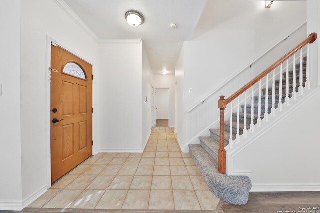 11502 Windwalk, San Antonio, TX 78253 - foyer with stairs, baseboards, light tile patterned floors, and crown molding