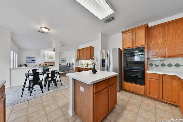 11502 Windwalk, San Antonio, TX 78253 - kitchen with stainless steel refrigerator with ice dispenser, a ceiling fan, light countertops, tasteful backsplash, and open floor plan