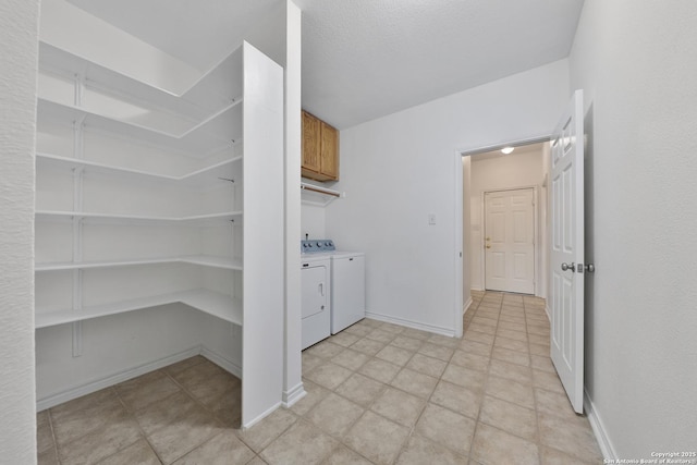 11502 Windwalk, San Antonio, TX 78253 - washroom featuring washer and clothes dryer, baseboards, and cabinet space