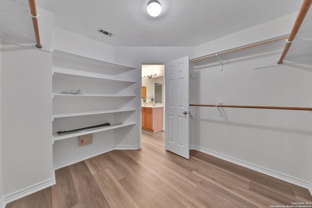11502 Windwalk, San Antonio, TX 78253 - spacious closet featuring light wood finished floors