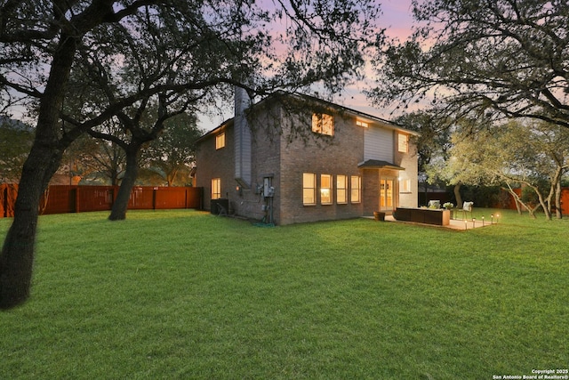11502 Windwalk, San Antonio, TX 78253 - back of house with brick siding, an outdoor living space, and a chimney