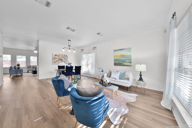 11502 Windwalk, San Antonio, TX 78253 - living room featuring light wood finished floors, baseboards, and a ceiling fan