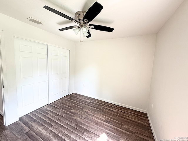 14663 Hillside Rdg, San Antonio, TX 78233 - unfurnished bedroom featuring dark wood finished floors, baseboards, a closet, and a ceiling fan