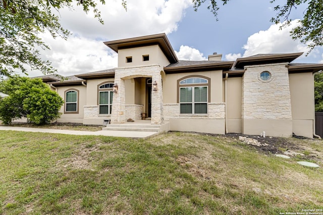 311 Wentworth, Spring Branch, TX 78070 - view of front of home with stone siding, stucco siding, a chimney, and a front lawn