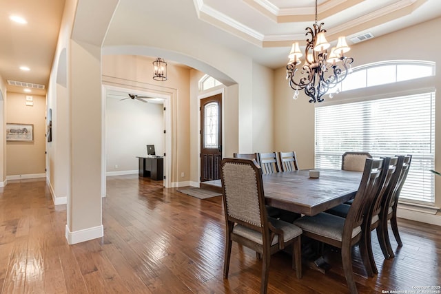 311 Wentworth, Spring Branch, TX 78070 - dining room with arched walkways, a chandelier, a raised ceiling, crown molding, and plenty of natural light