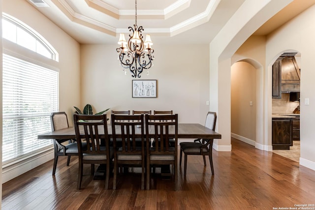 311 Wentworth, Spring Branch, TX 78070 - dining room with a tray ceiling, plenty of natural light, arched walkways, ornamental molding, and a chandelier