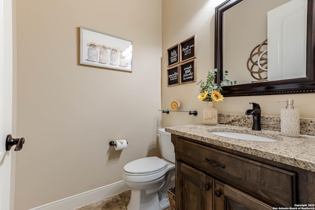 311 Wentworth, Spring Branch, TX 78070 - half bathroom with vanity, toilet, baseboards, and tile patterned floors