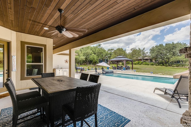 311 Wentworth, Spring Branch, TX 78070 - view of patio featuring a gazebo, a ceiling fan, an outdoor pool, and outdoor dining space