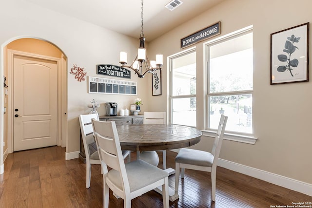 311 Wentworth, Spring Branch, TX 78070 - dining area featuring a chandelier, baseboards, wood finished floors, and arched walkways