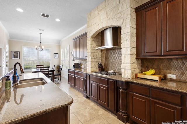 9718 Rosemire Way, San Antonio, TX 78254 - kitchen featuring a sink, light tile patterned floors, crown molding, stainless steel gas cooktop, and wall chimney range hood