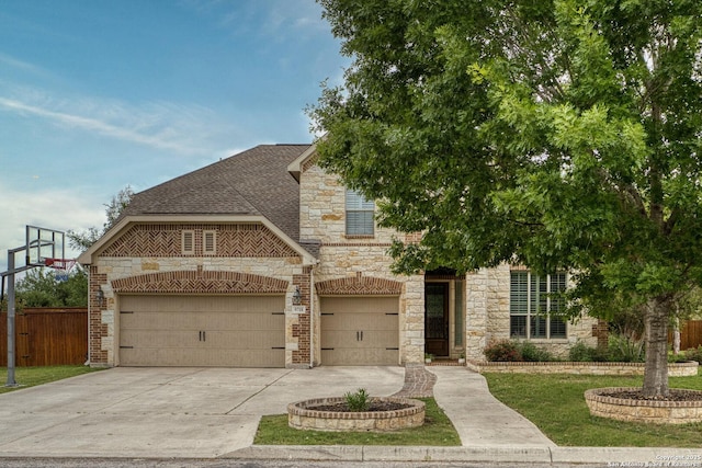 9718 Rosemire Way, San Antonio, TX 78254 - view of front of house with stone siding, concrete driveway, brick siding, roof with shingles, and a garage