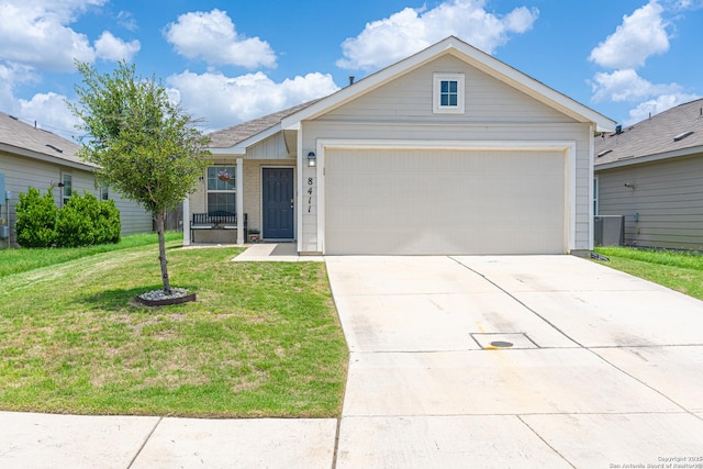 8411 Terlingua Cv, Converse, TX 78109 - ranch-style house featuring a front lawn, driveway, and a garage