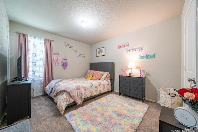 8411 Terlingua Cv, Converse, TX 78109 - carpeted bedroom featuring a textured ceiling