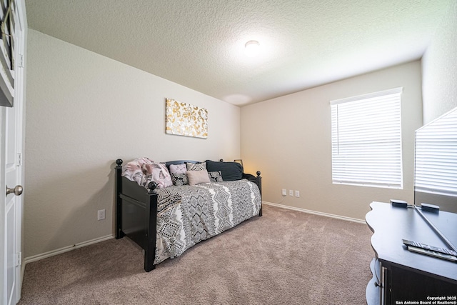 8411 Terlingua Cv, Converse, TX 78109 - bedroom with carpet floors, baseboards, and a textured ceiling