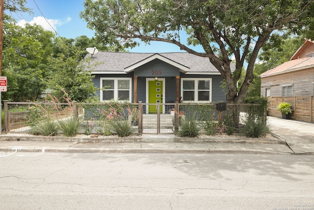 203 Rehmann, San Antonio, TX 78204 - view of front of house featuring a fenced front yard, a shingled roof, and a porch