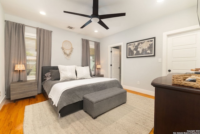 203 Rehmann, San Antonio, TX 78204 - bedroom with multiple windows, light wood-style floors, baseboards, recessed lighting, and a ceiling fan