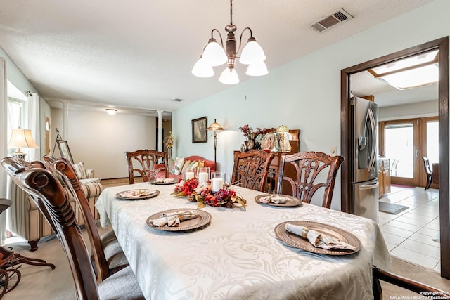 16519 Burr Hill, San Antonio, TX 78247 - dining room featuring a chandelier, a textured ceiling, and light tile patterned flooring